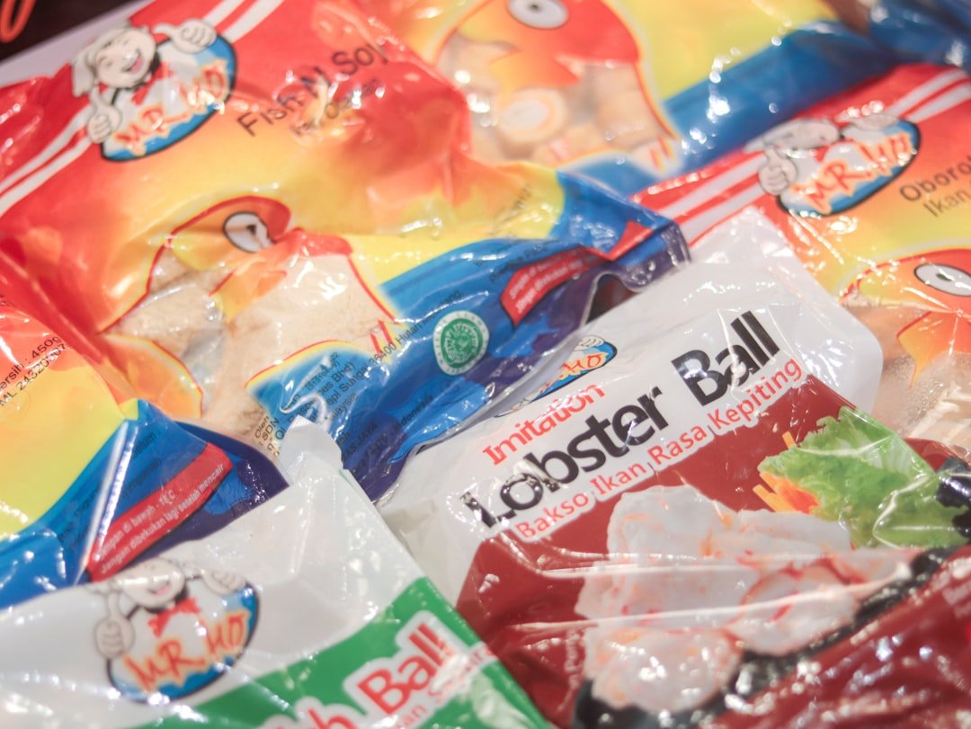 A vibrant supermarket display featuring fruits, groceries, food, and non-food items