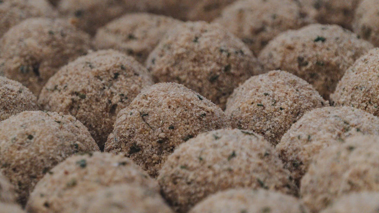 Close-up view of breadcrumb-coated balls, ideal for culinary presentation.